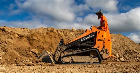 mini skid steer joystick|jackal stand on mini skid steer.